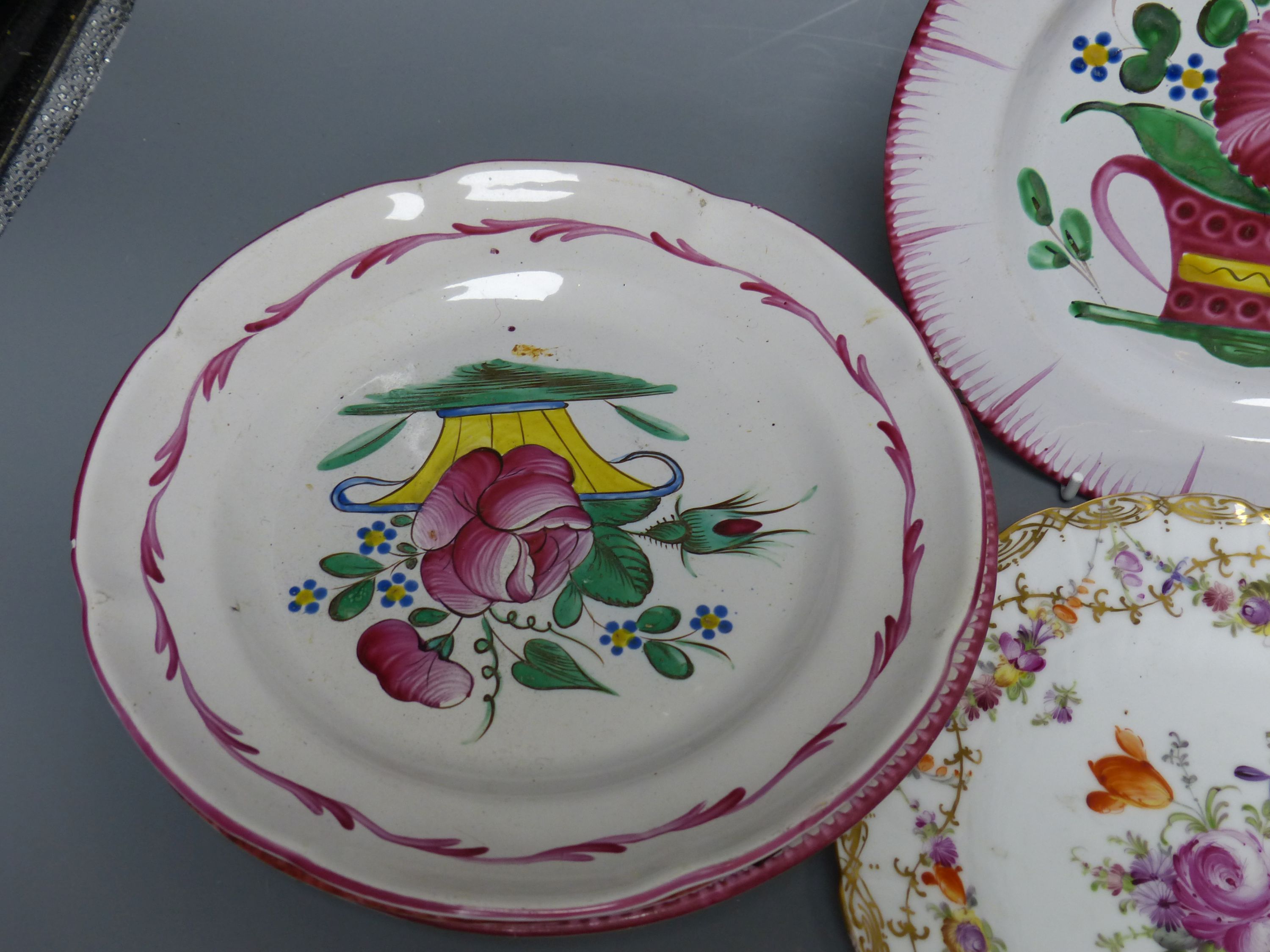 Seven French faience plates and a Dresden plate